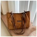 Corduroy one-shoulder large capacity tote handbag for women in black, brown, and white with outer pocket