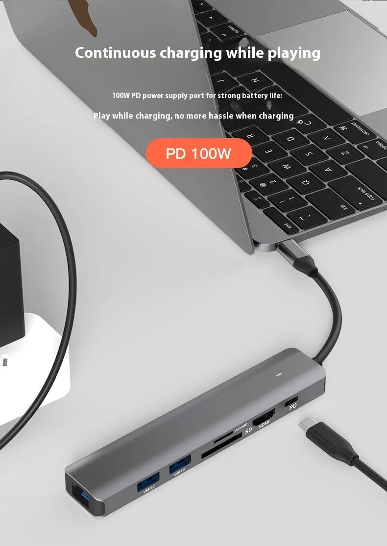 LQT-LH07 seven-in-one USB C hub and card reader adapter for laptops on a desk.