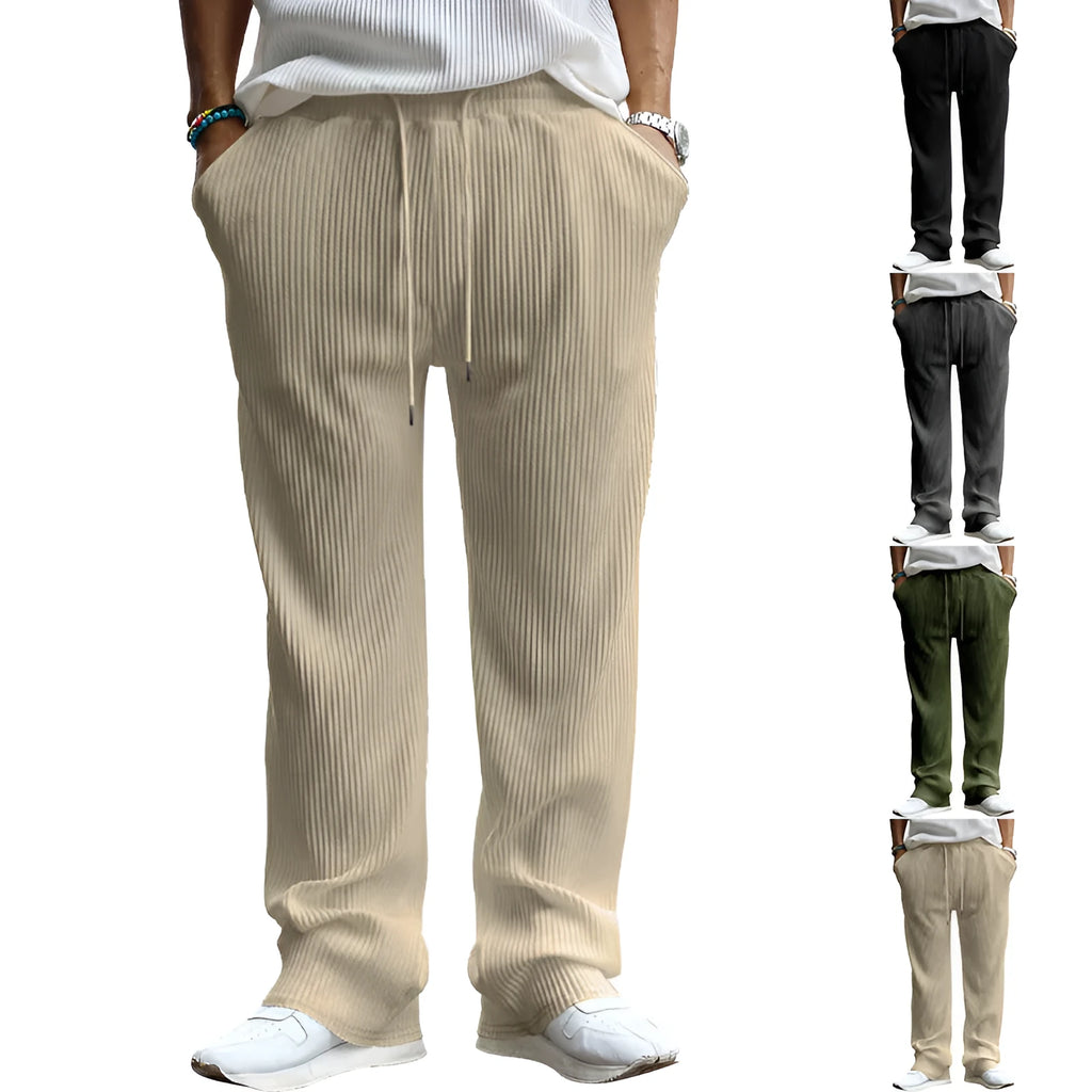 Man wearing loose-fitting straight leg casual trousers in army green, showing high waist and relaxed fit.