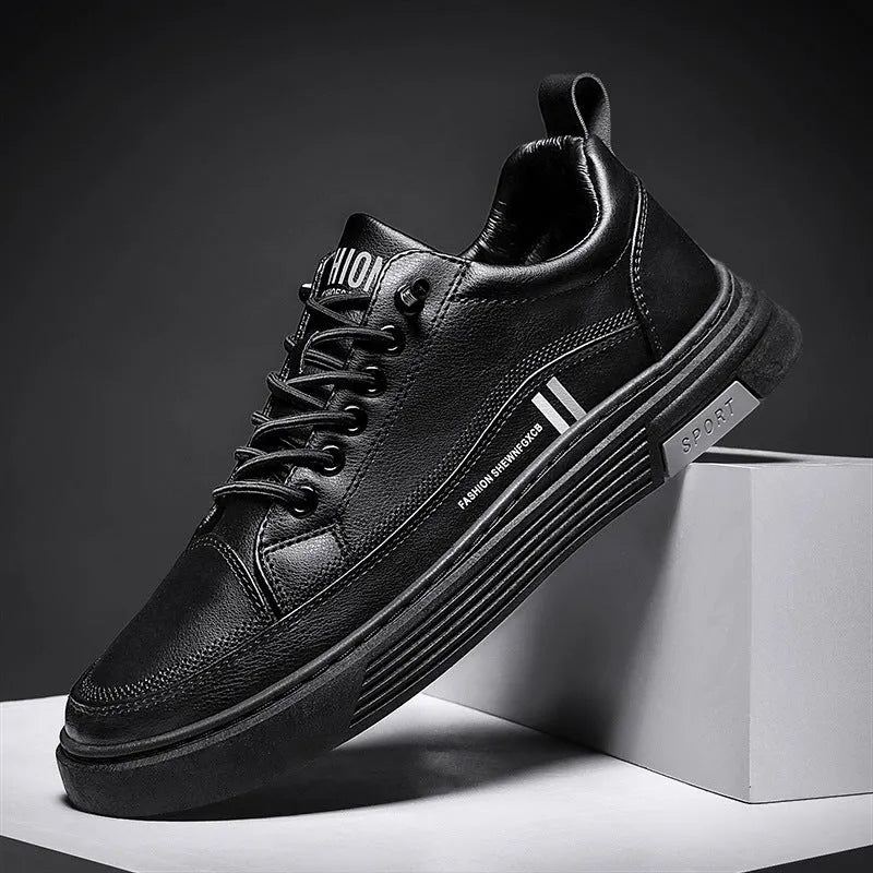 Men's low-top black and white skateboard shoes with elastic band closure and round toe.