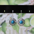 Miao silver geometric flower disk earrings with turquoise and auspicious cloud patterns