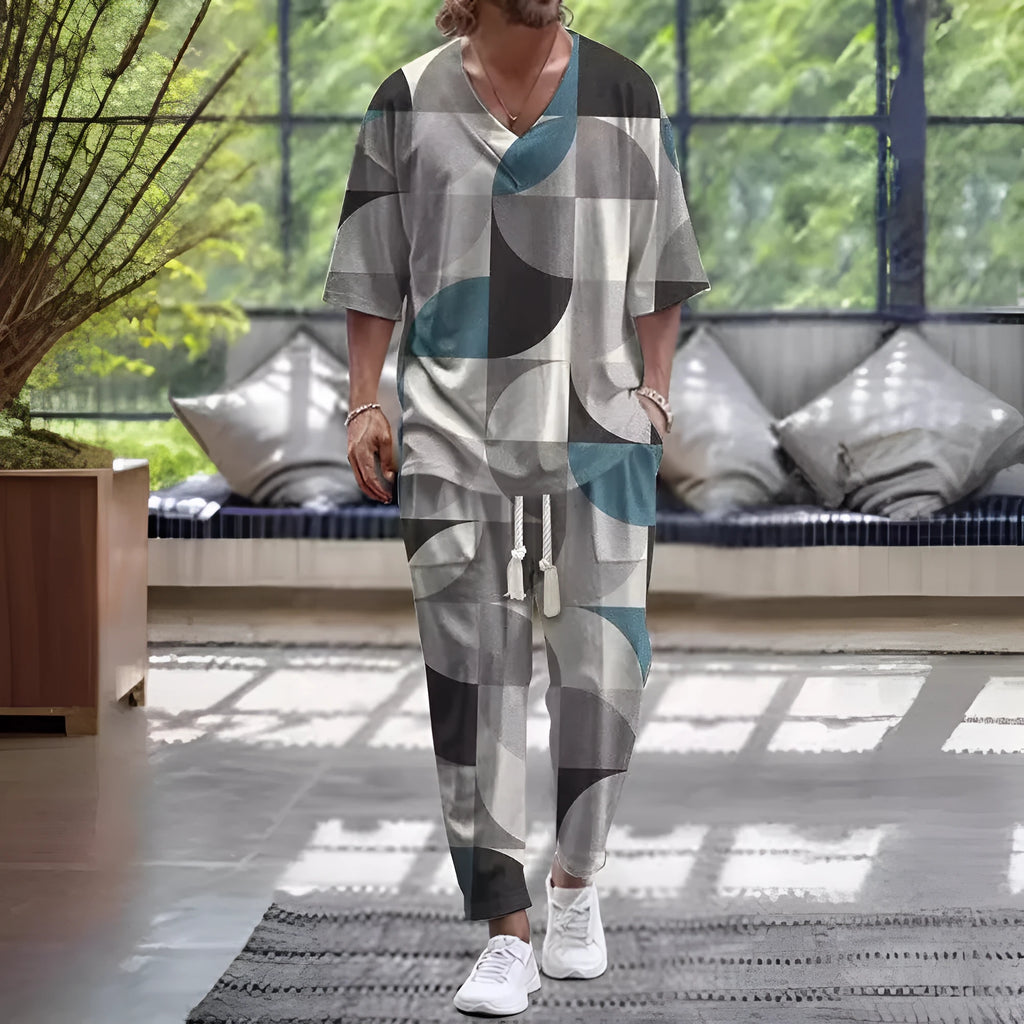 Lightweight grey polyester two-piece trousers suit with V-neck jacket and matching trousers on a hanger.
