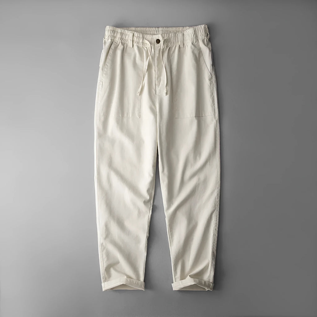 Men's linen casual trousers in navy blue, shown with a mid-waist and standard trouser length.