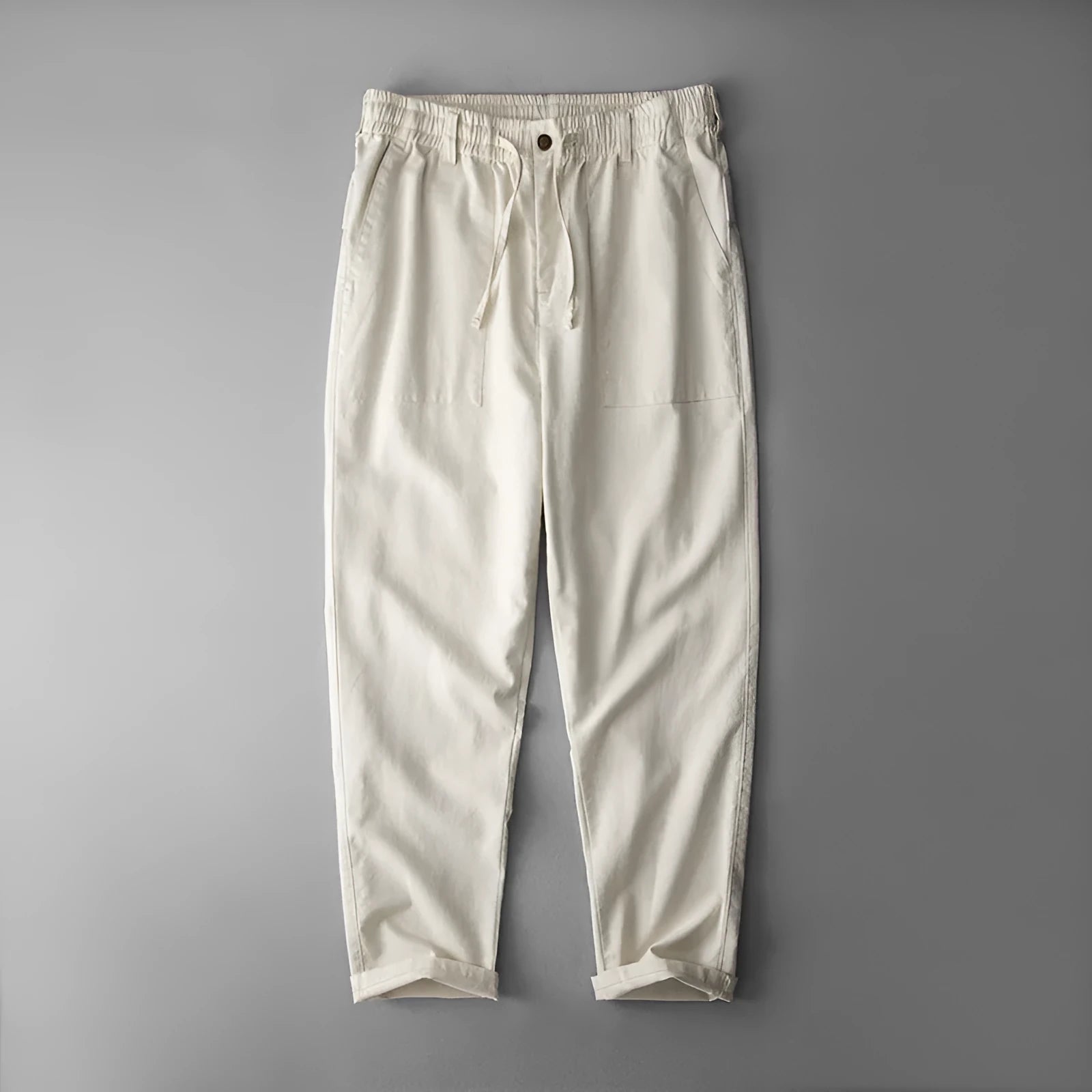 Men's linen casual trousers in navy blue, shown with a mid-waist and standard trouser length.