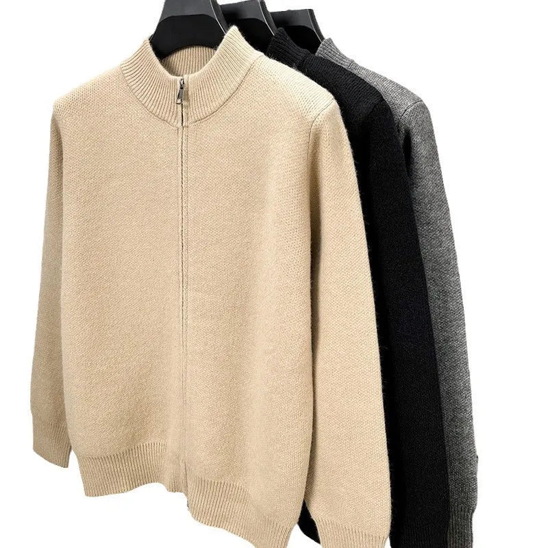 Men's black zip-up knitted cardigan with a stand collar, shown on a model.