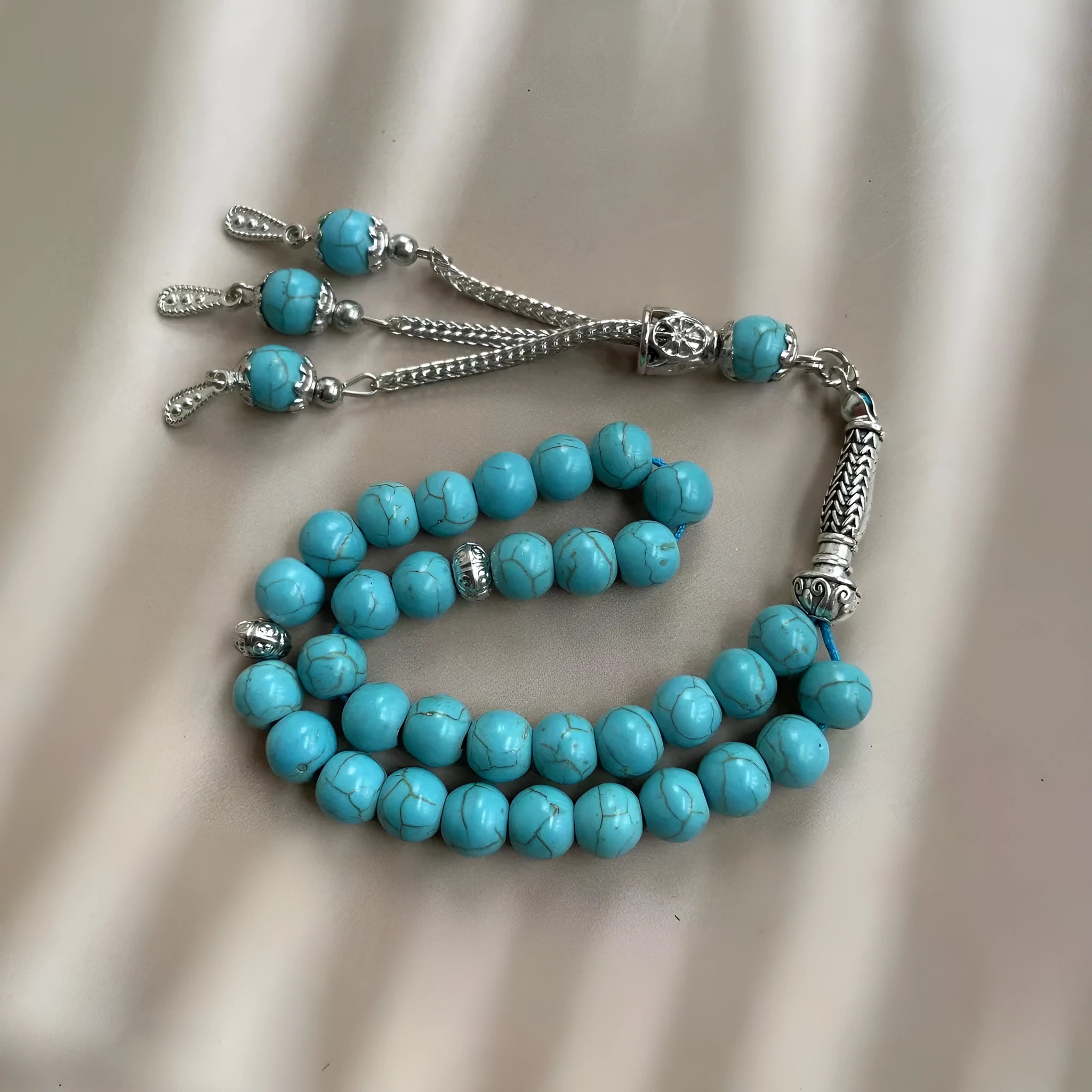 Handmade sky blue stone Muslim prayer bracelet with 8mm beads on wrist.