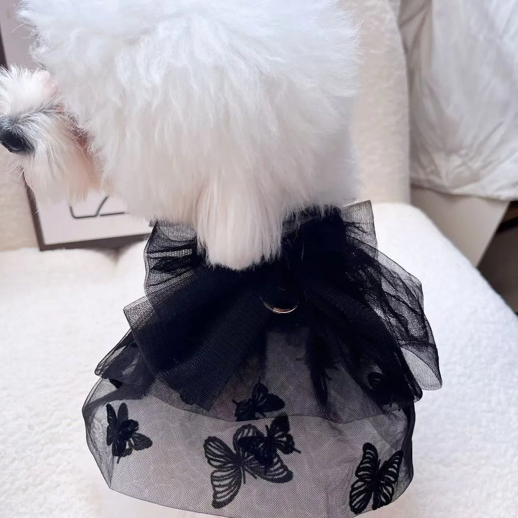 Black tulle princess skirt costume on small dog, showing tiered gauze design and adjustable fit.