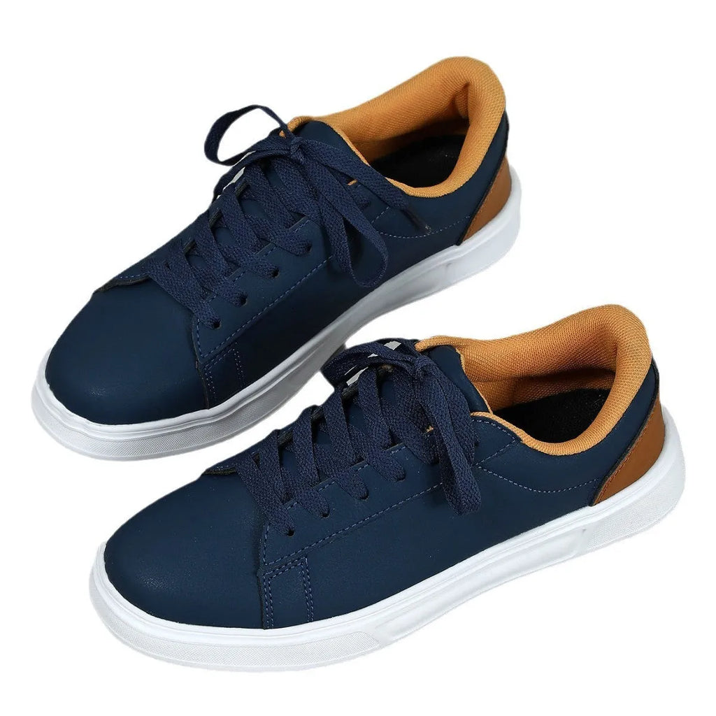 Beige brown platform casual sneaker with cross-belt detail and a low-top silhouette on a white background.