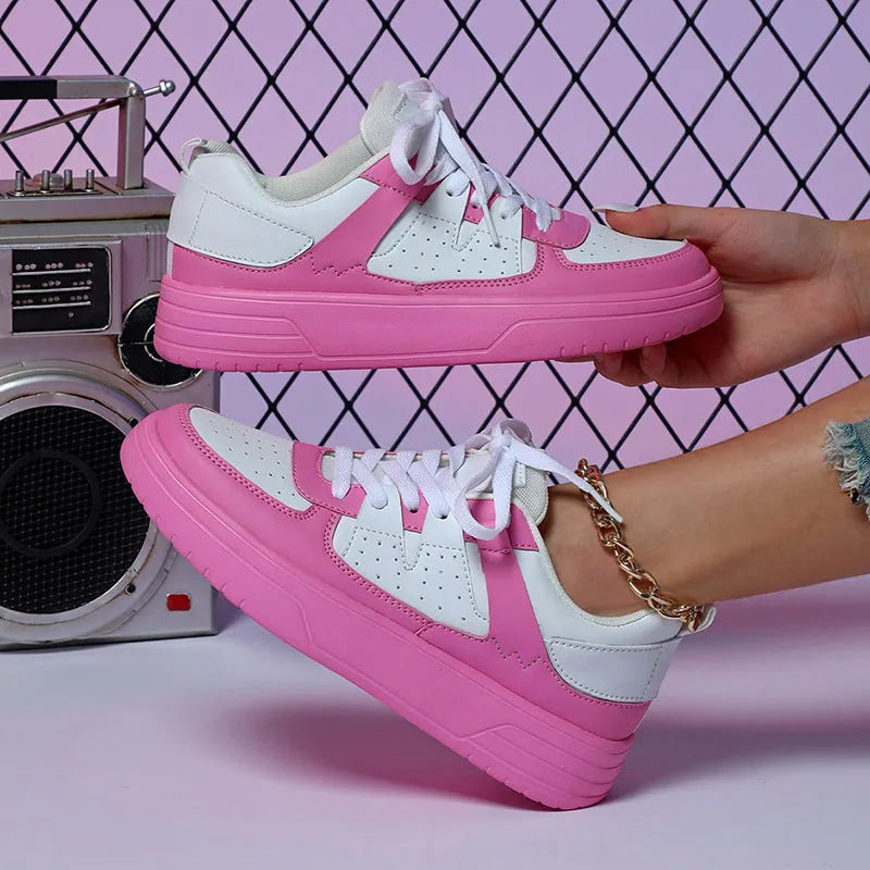 Casual solid colour low top sports shoes with front lace-up, round toe, and metal accents on a white background