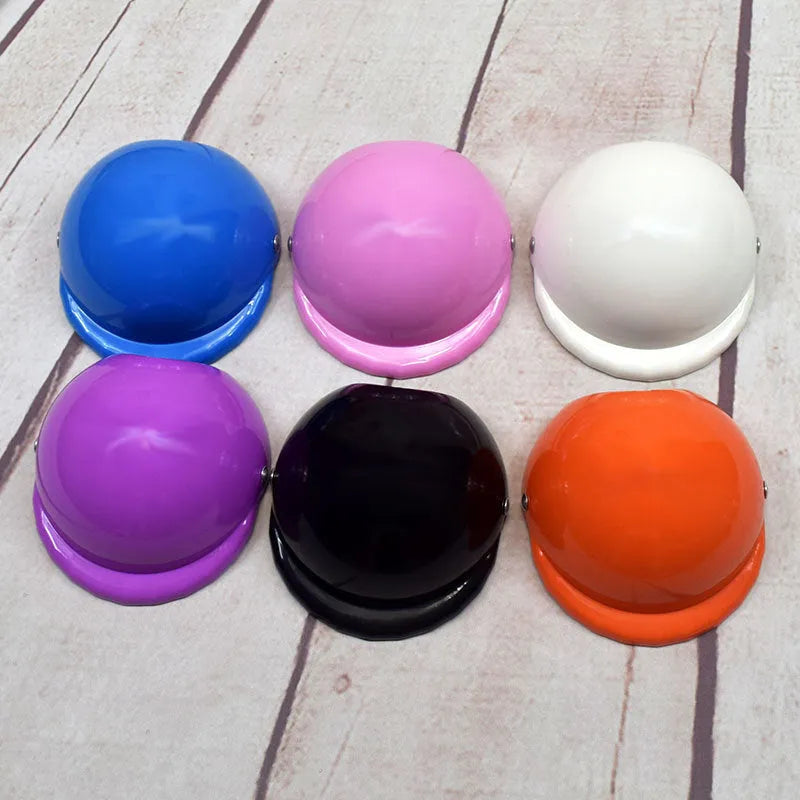 Plastic dog motorcycle helmet in pink colour showing solid design and structured form