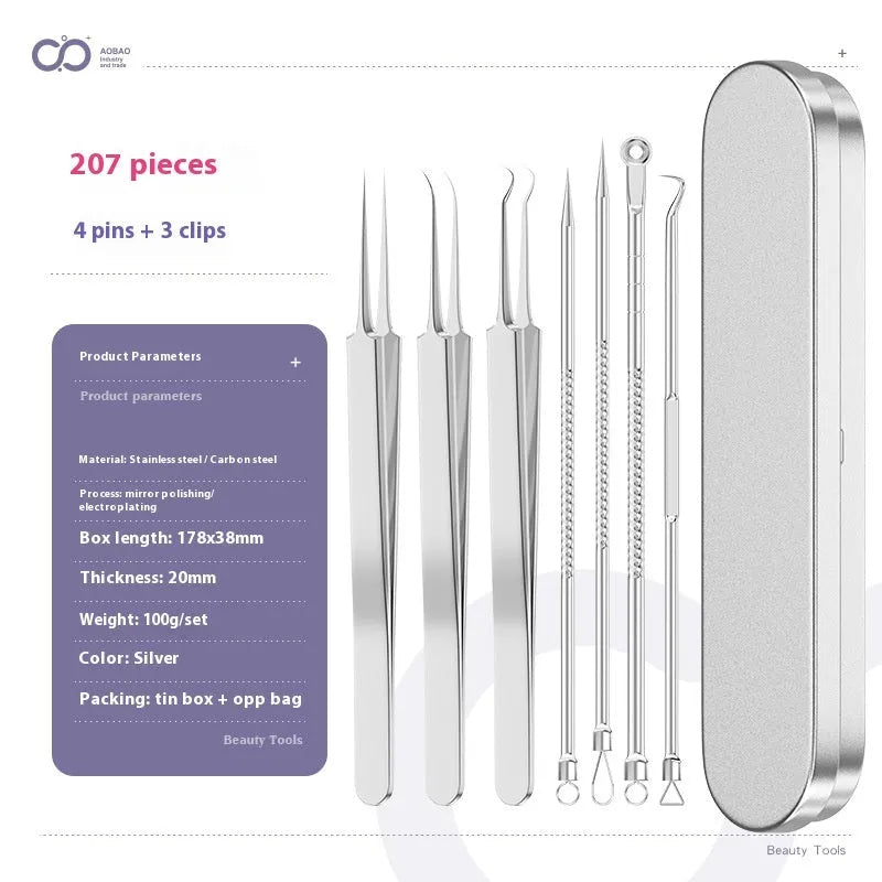 Four silver metal acne needles with fine pointed tips laid out on a surface.