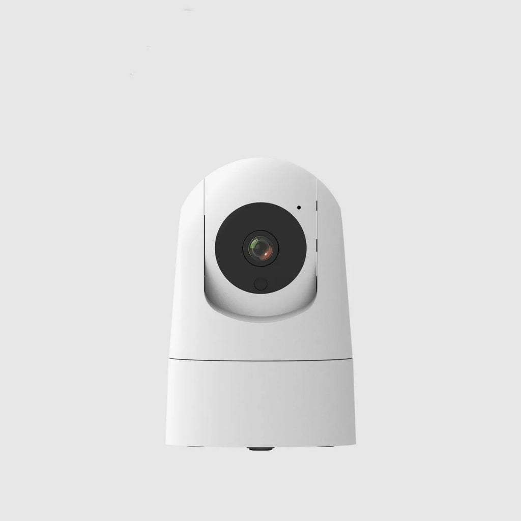 Compact white indoor smart security camera on a stand with a visible lens.