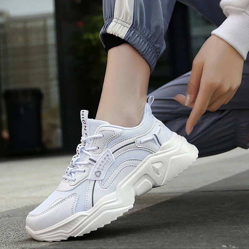 White women's thick-soled casual sports shoes with mesh upper and buckle detail