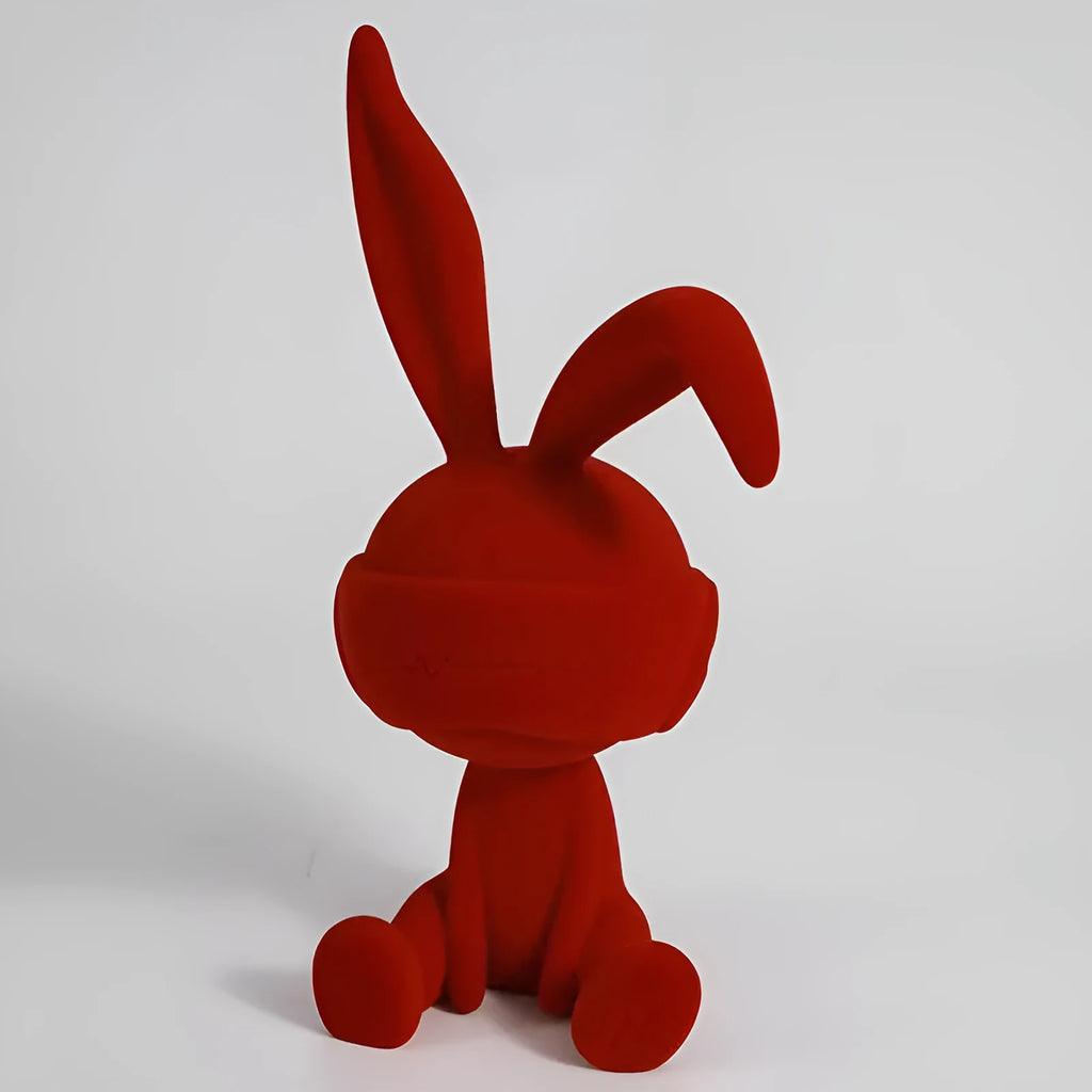 Resin rabbit ornament with suede blindfold in blue, green, or red colour options