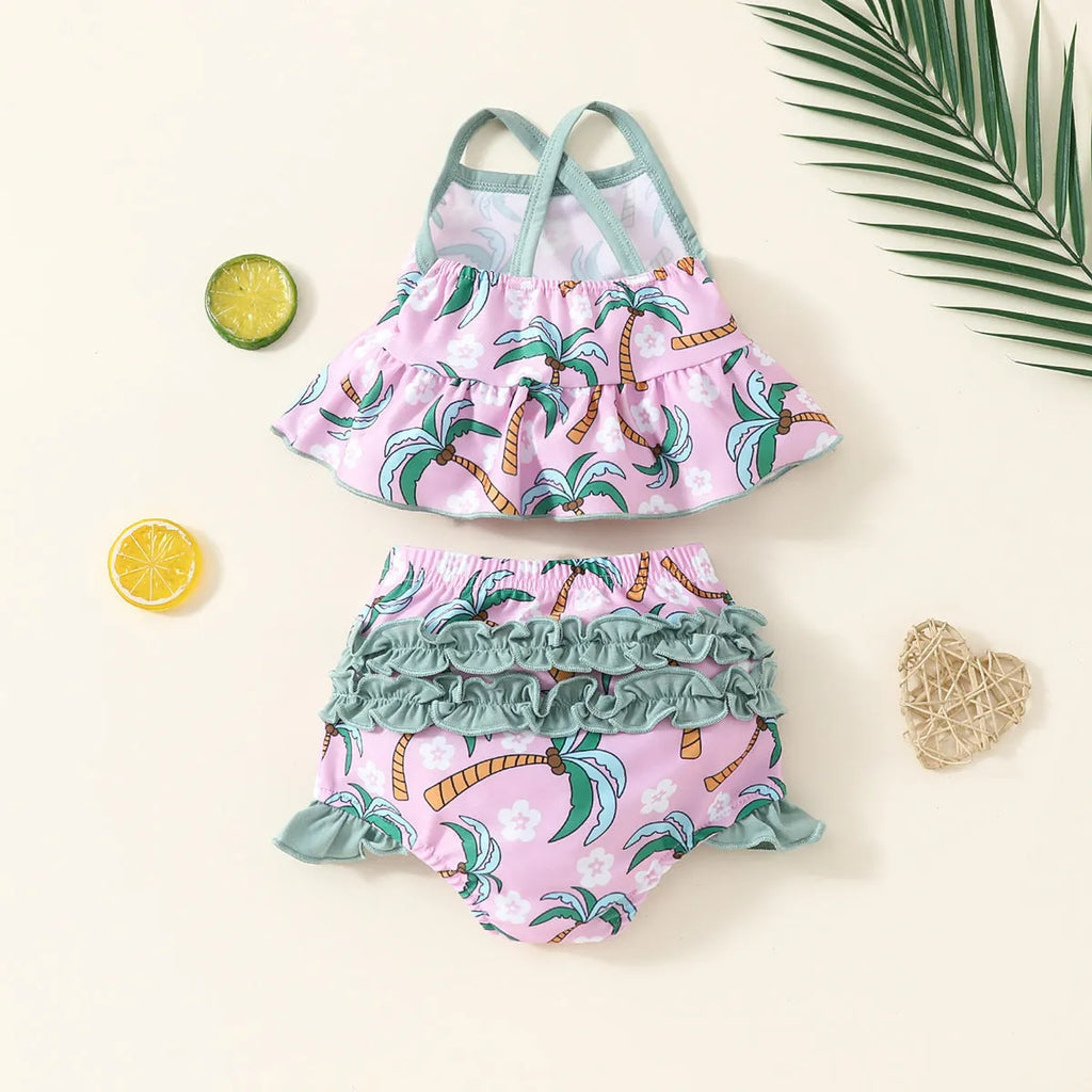 White children's two-piece swimsuit set comprising a top and shorts made from polyester.