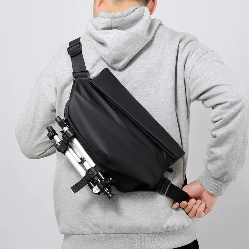 Grey horizontal square PU leather crossbody bag for men with a single shoulder strap.