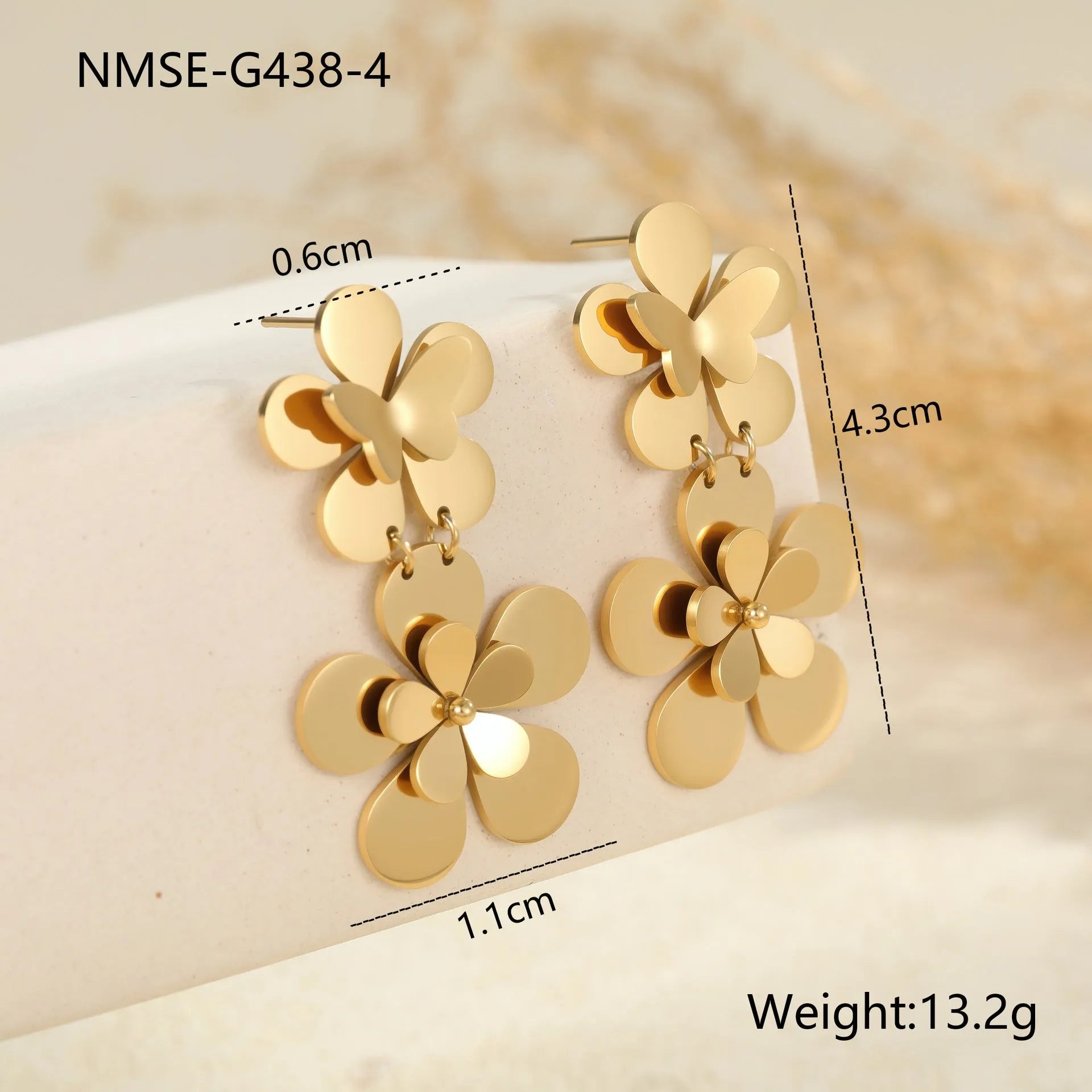 Women's stainless steel earrings with 18K gold electroplated flower butterfly design and post backs