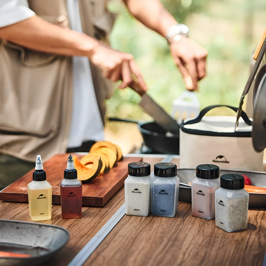 Naturehike set of six white portable seasoning bottles for outdoor picnics and camping.