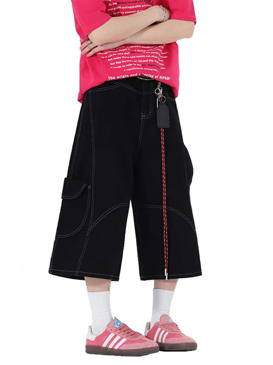 Women's retro denim shorts with multiple pockets in a wide-leg cropped style on a hanger.