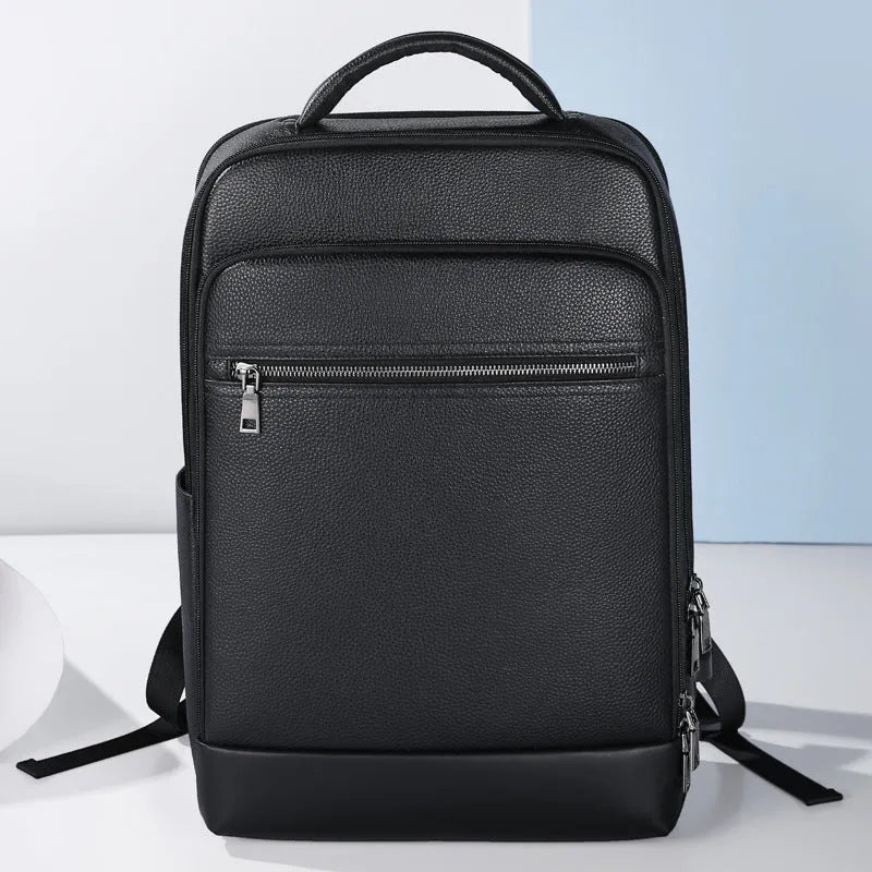 Black genuine cowhide leather men's business backpack with curved shoulder strap.