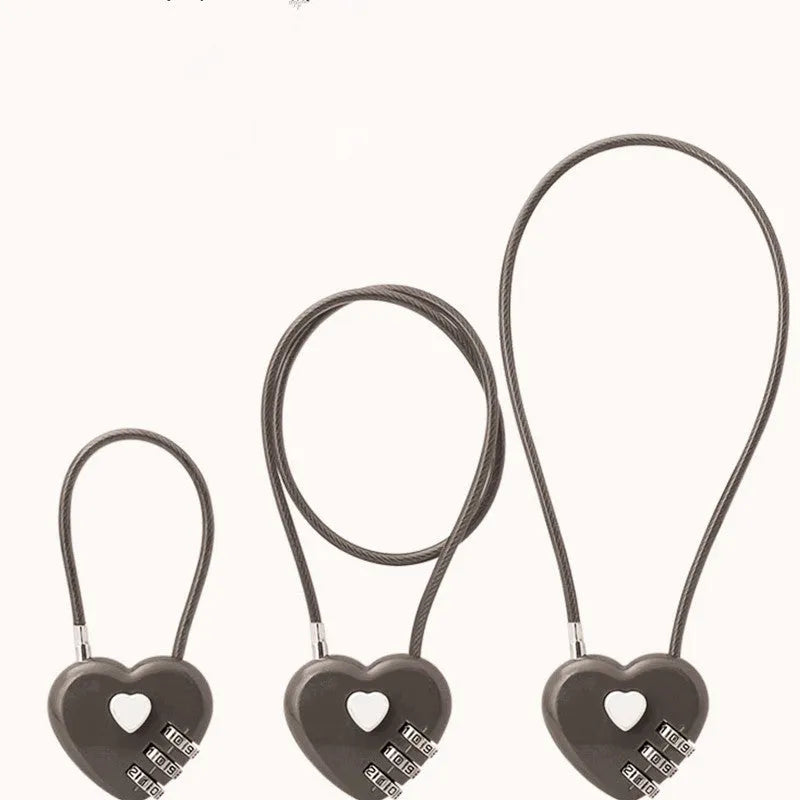 Peach heart love lock with long wire rope for bicycle helmet security in black colour on a white background