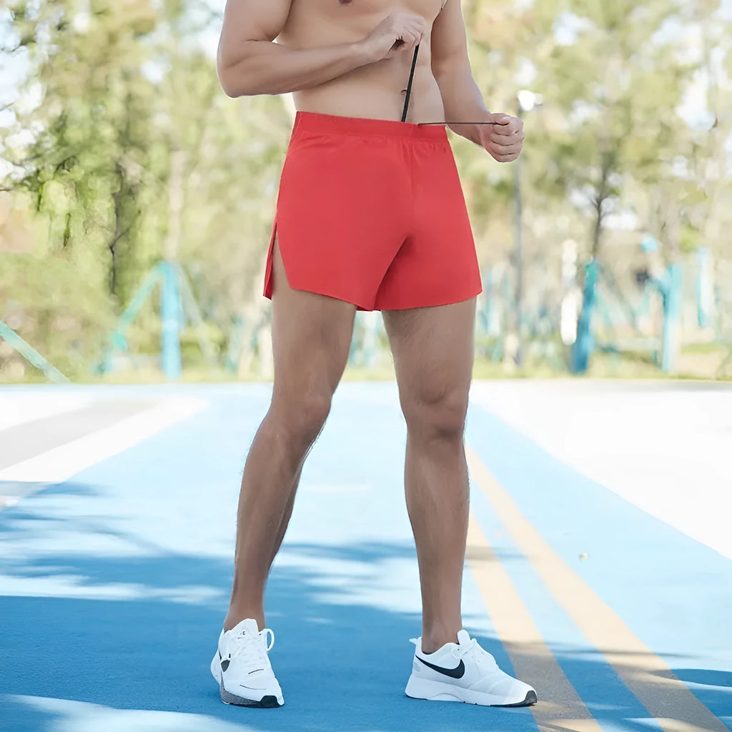 Men's loose fit off-road running shorts in black, shown from front and side.
