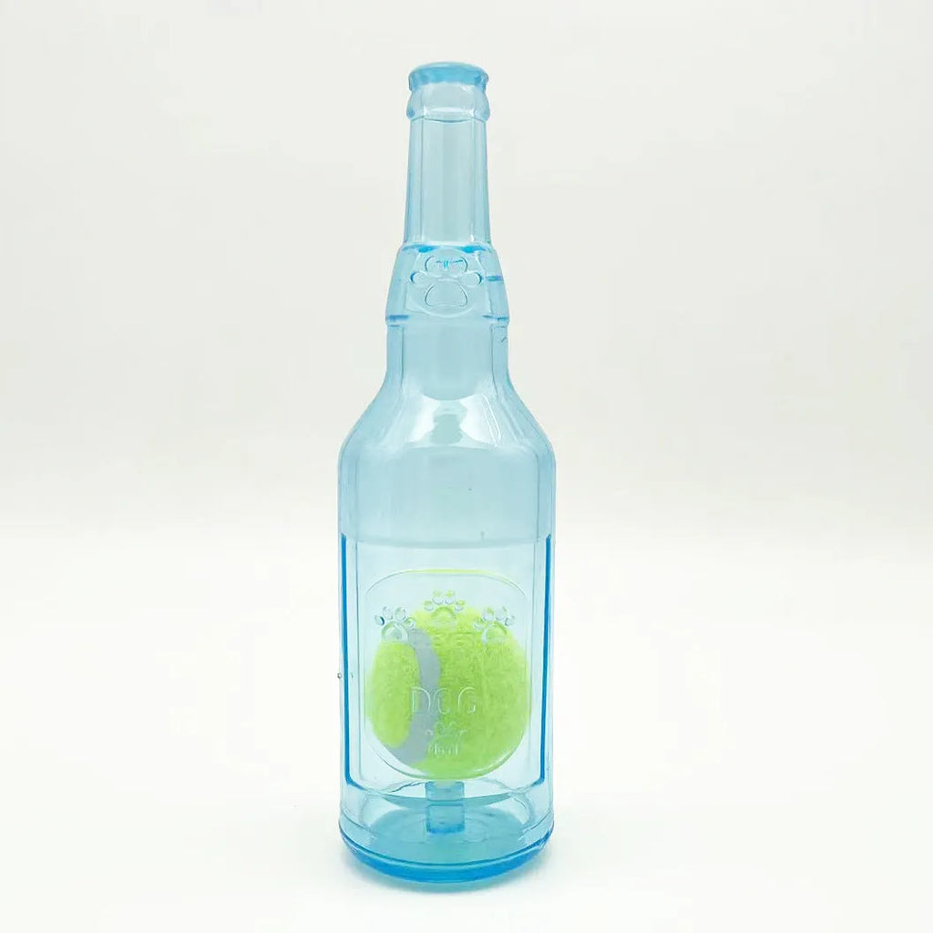 Blue water bottle dog toy with squeaker and internal tennis ball on grass