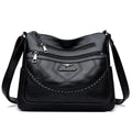 Soft PU leather shoulder bag in horizontal square shape with crossbody strap and multiple compartments