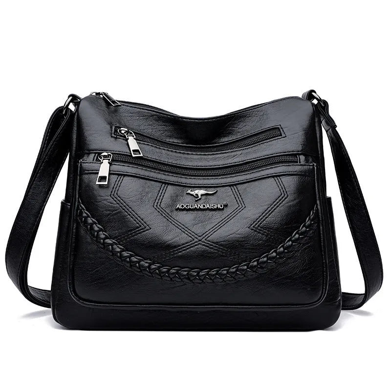 Soft PU leather shoulder bag in horizontal square shape with crossbody strap and multiple compartments