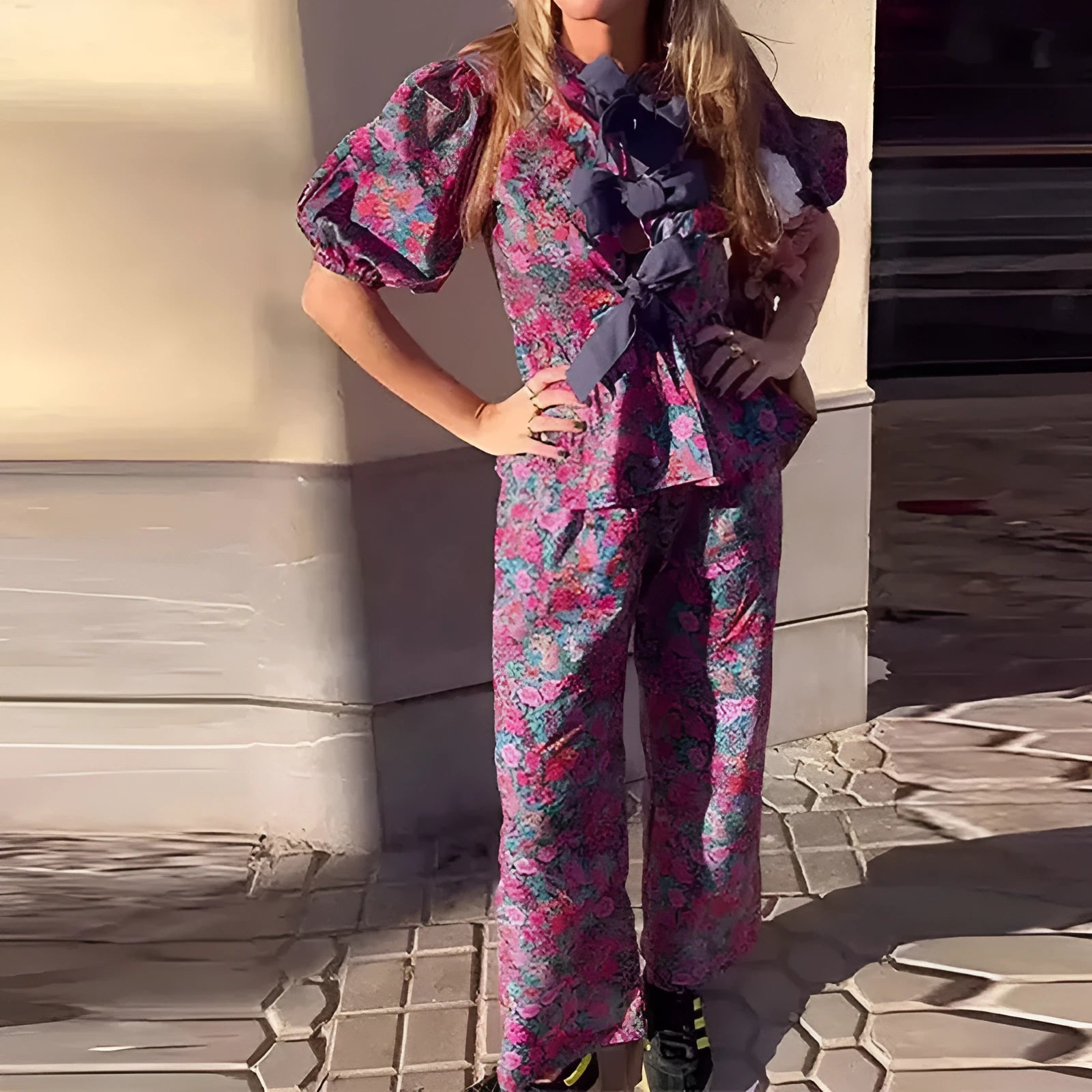 Floral printed women's trouser suit with puff sleeve top and tie-neck
