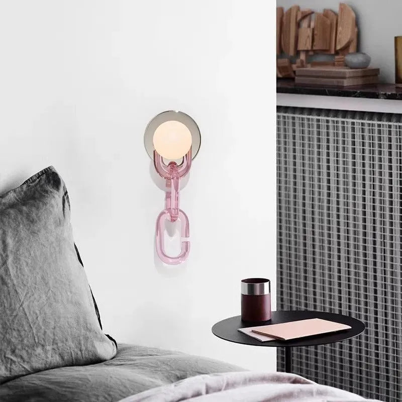 Simple glass ball bedroom wall lamp with black base and milky white chain, warm LED light