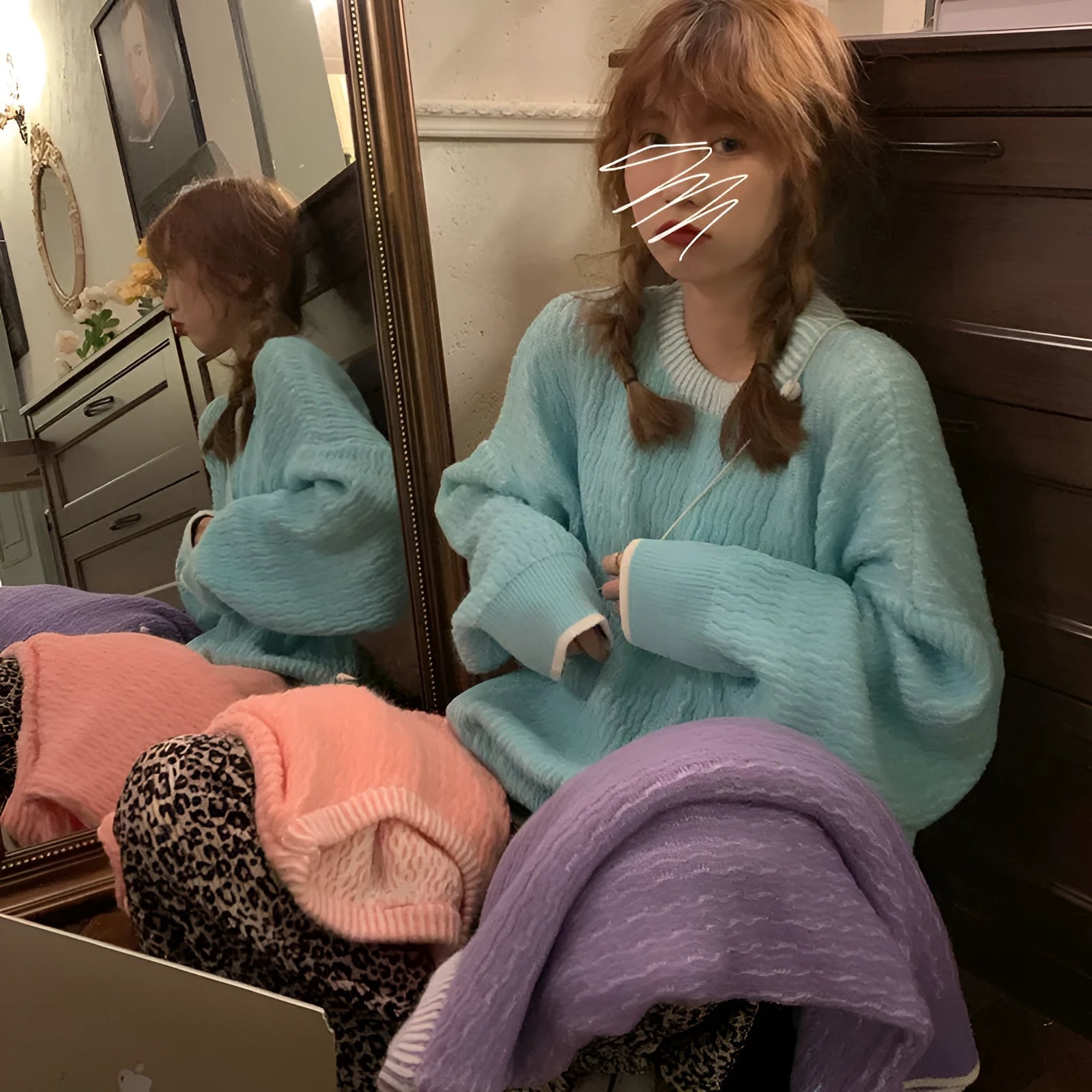 Women's loose fit solid colour polyester pullover sweater shown in lake blue
