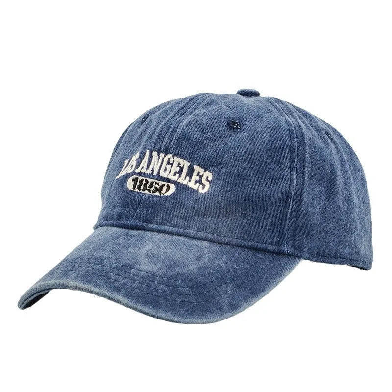 Adjustable peak cap with embroidered letters in distressed retro style, showing conical crown and 7cm brim
