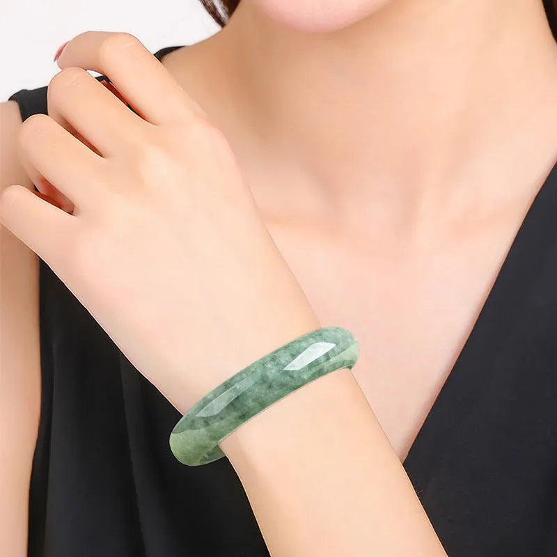 Natural emerald deep pea green jade bracelet simple style on white background with certificate and gift box