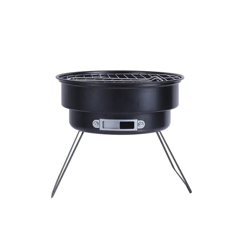 Small portable folding round ice stove barbecue grill set with mesh, legs, and clip on a grey background.