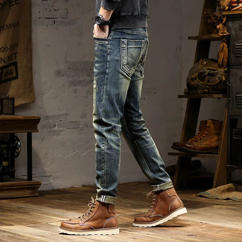 Men's skinny fit jeans in retro colour showing zip fly and tapered leg.