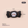 Plush cat teaser wand toy with colourful candy and skull designs on small attachment