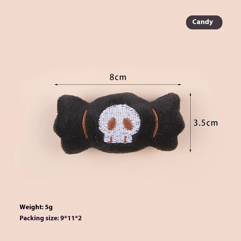 Plush cat teaser wand toy with colourful candy and skull designs on small attachment
