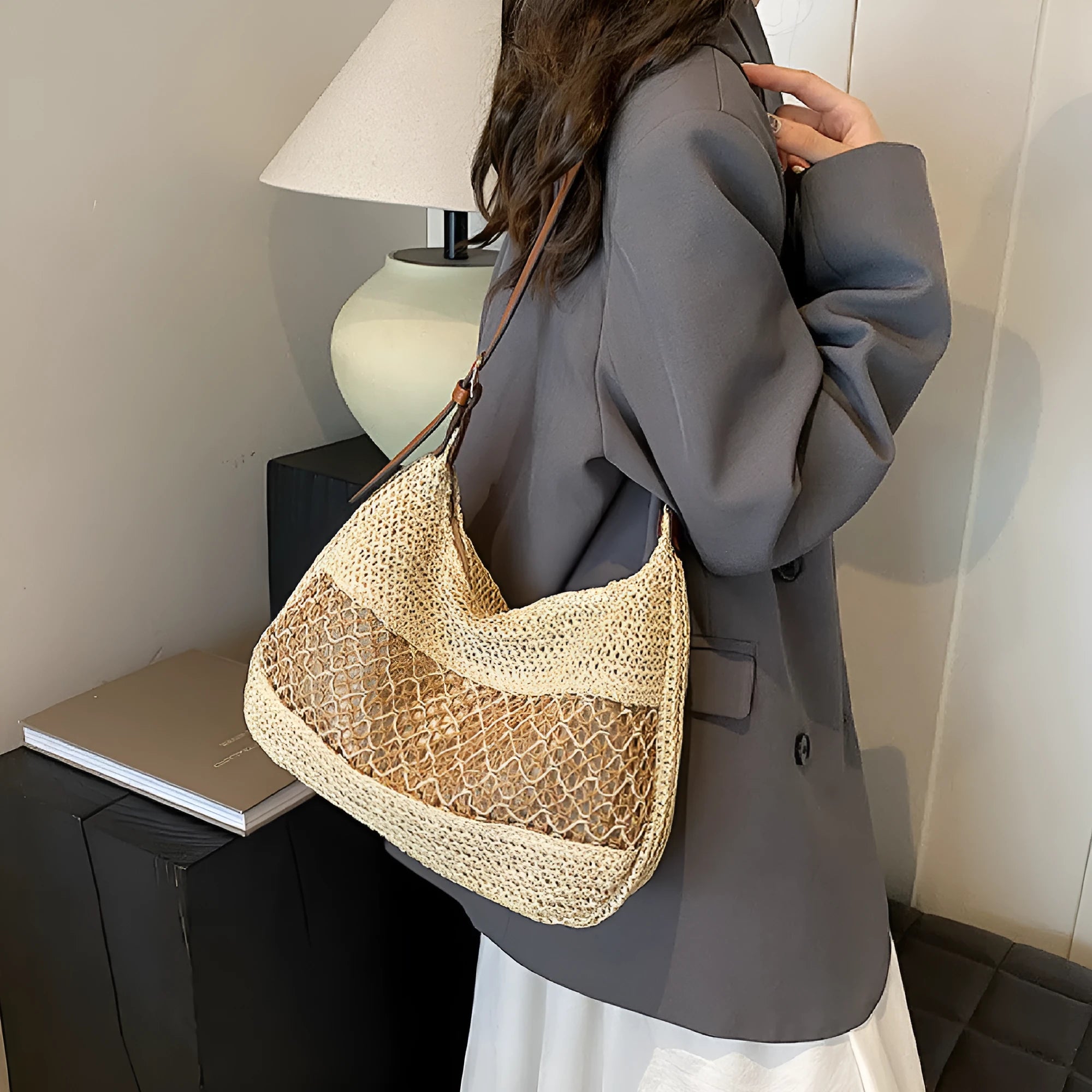 Women's straw cross body bag with horizontal square shape in khaki colour showing sandwich pocket design
