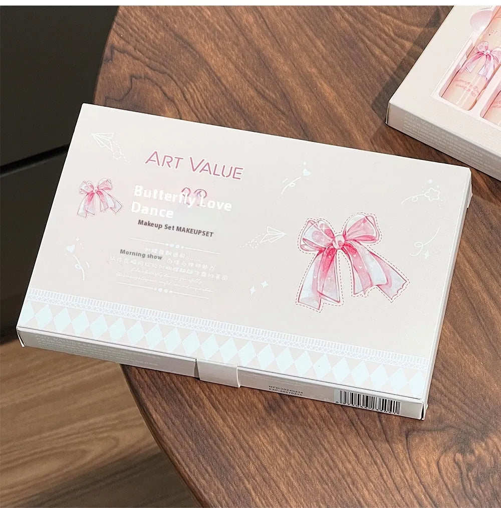 Butterfly Box makeup set showing four pink matte lip muds, powder blusher, and necklace