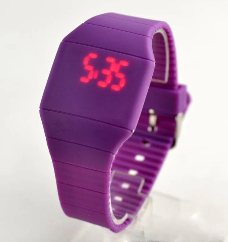 Square digital electronic watch with touch screen on a coloured PU strap.