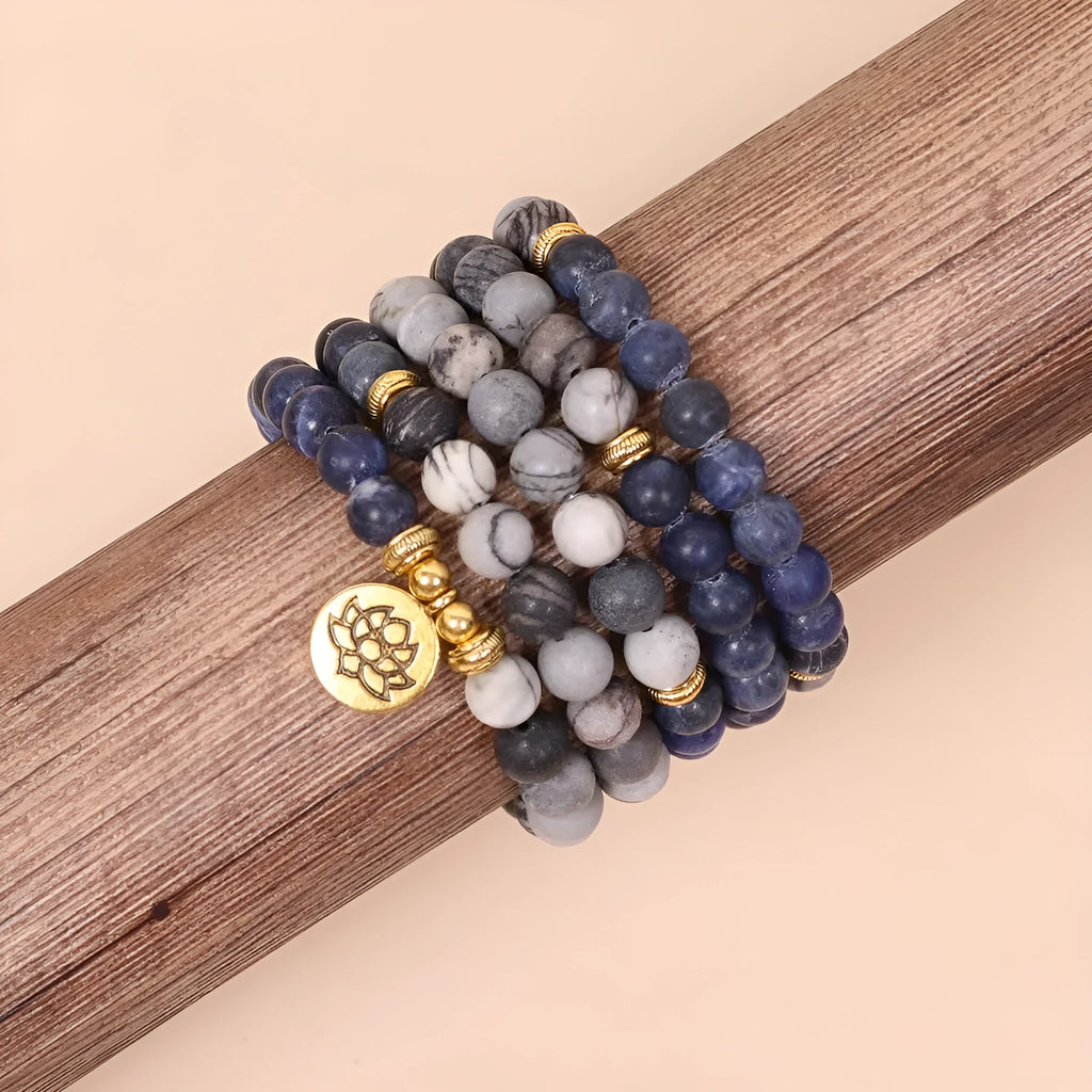 Multi-layer alloy women's bracelet with blue patterned network stone beads.