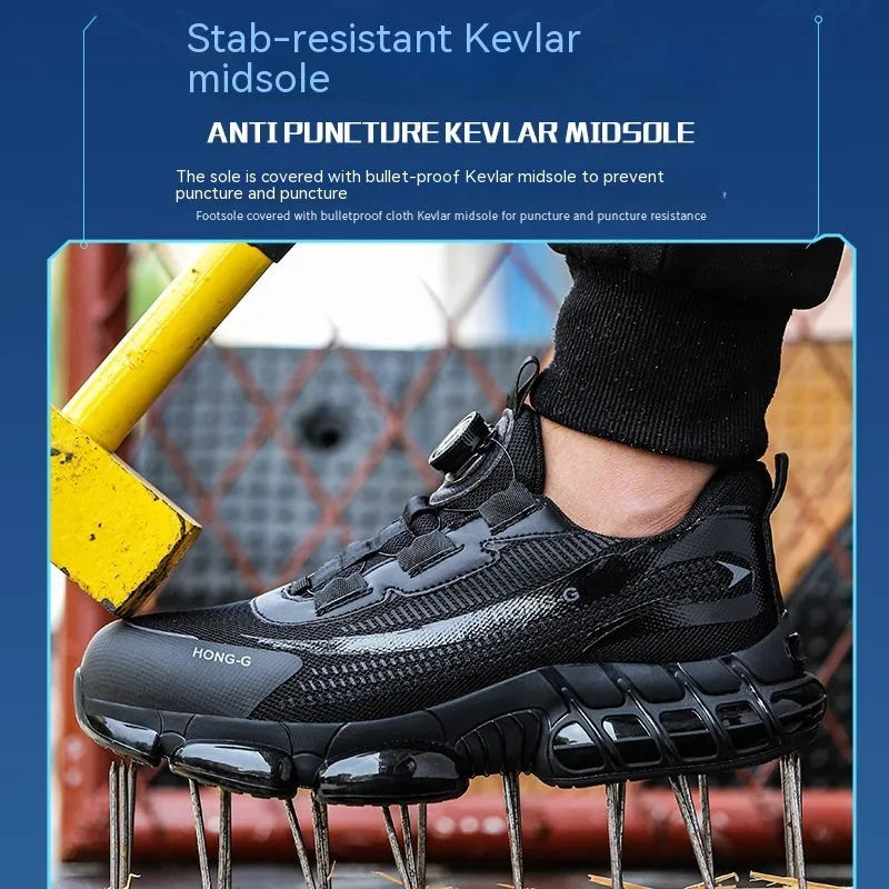 Lightweight black safety work shoes with a steel toe cap and breathable flyweave upper on a work floor.