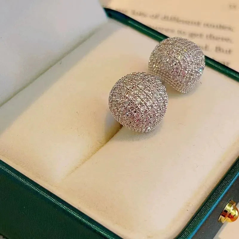 Gold and white geometric drop earrings with sphere elements and crystal embellishments