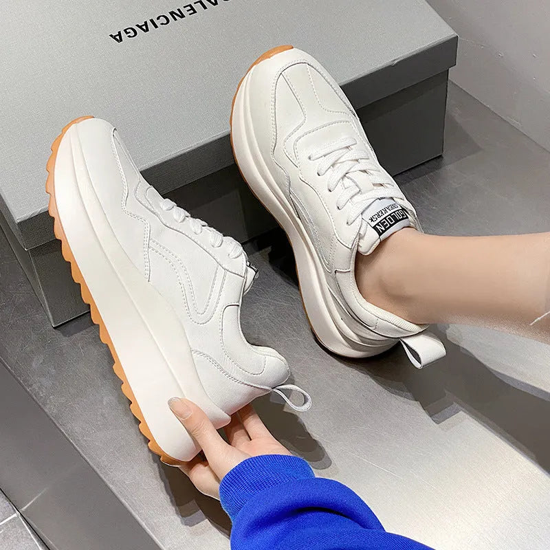 White women's cattlehide leather low-top casual sports shoes with a cross-strap and round toe.