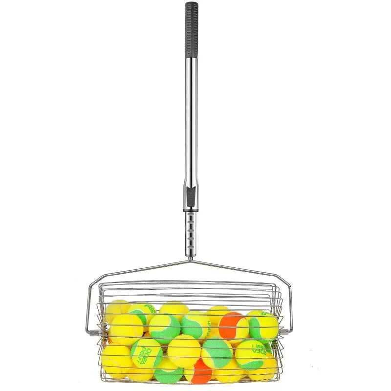 Stainless steel tennis ball picker roller on a court next to tennis balls.