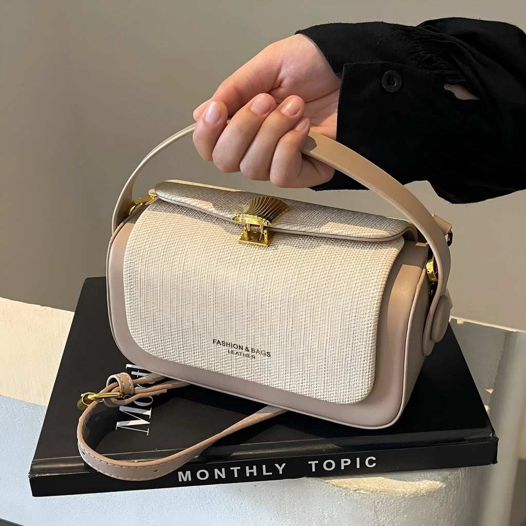 Women's PU leather messenger bag in horizontal square shape with contrast colour stitching and lock closure, available in multiple colours
