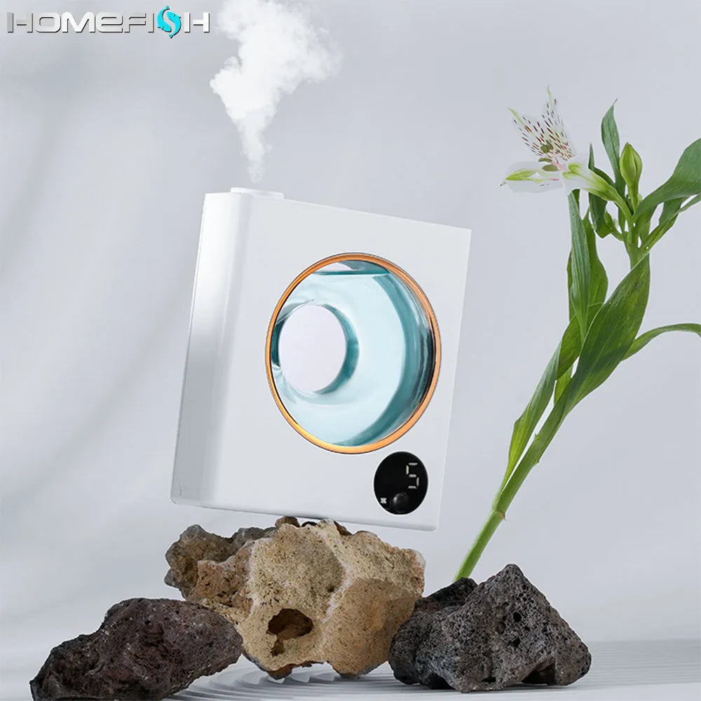 Small white automatic aromatherapy machine mounted on wall with USB charging cable