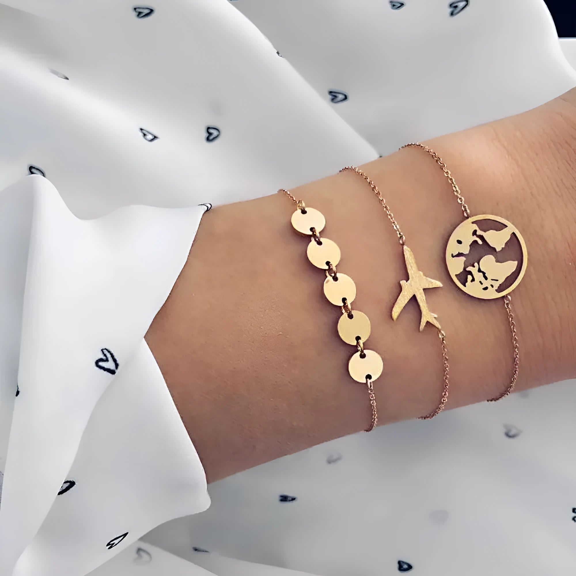 Set of three women's bohemian bracelets with heart-shaped aircraft map charms.