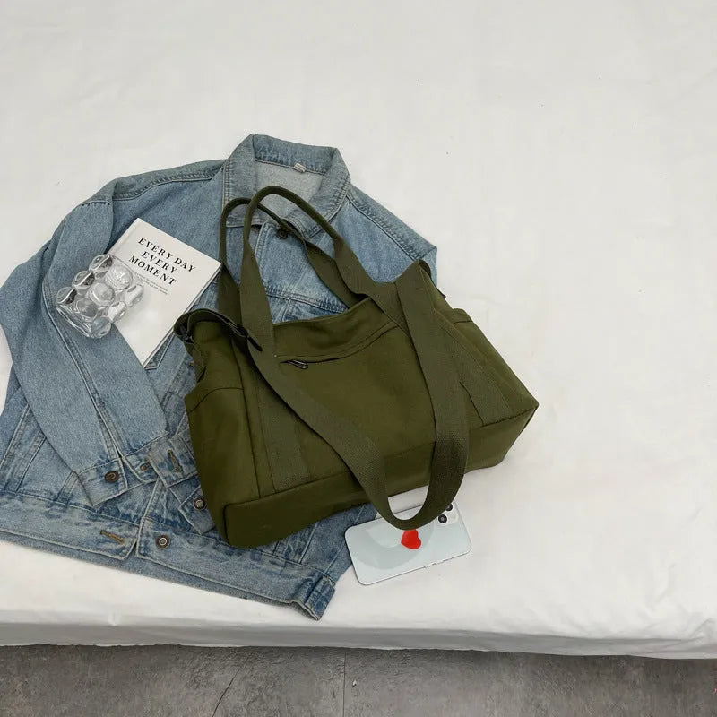 Women's polyester canvas shoulder tote bag in solid colour with exterior sandwich pocket